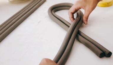 hands making a clay knot